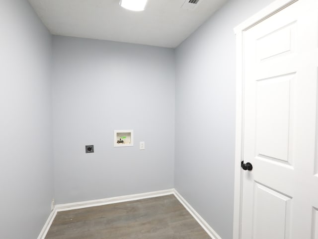 laundry room featuring hookup for an electric dryer, hookup for a washing machine, and dark hardwood / wood-style floors