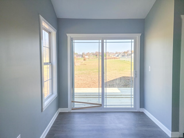 doorway to outside with dark hardwood / wood-style floors