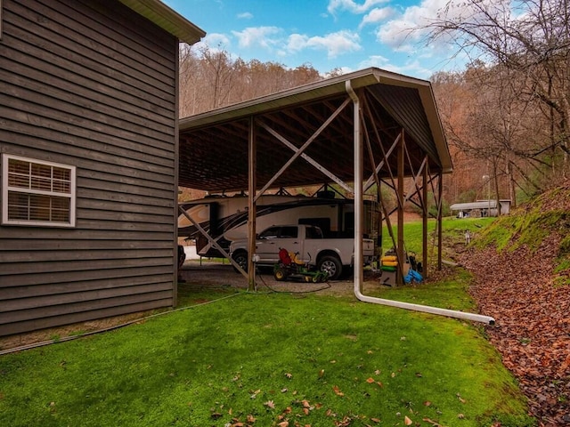 view of car parking with a carport and a lawn