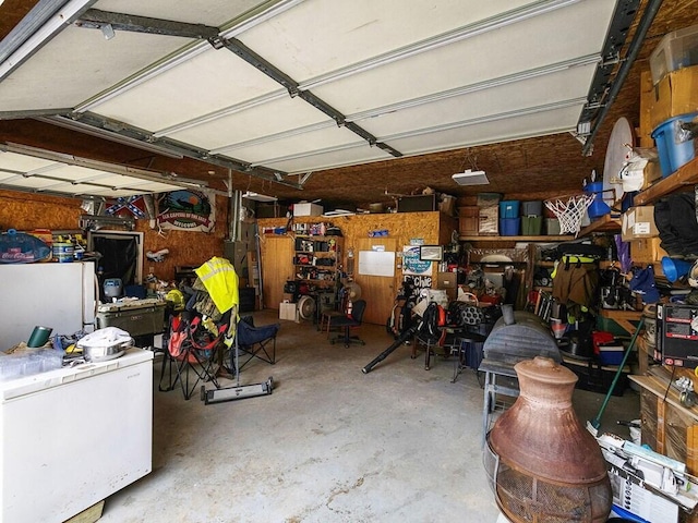 garage featuring white fridge