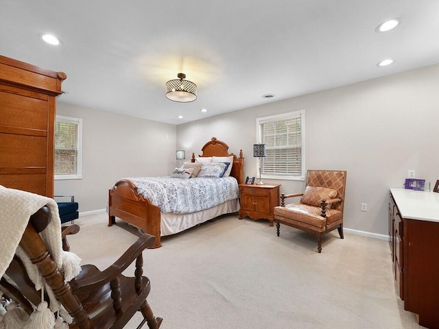 bedroom featuring light colored carpet