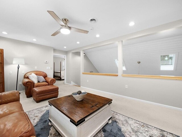 living room featuring ceiling fan and light carpet