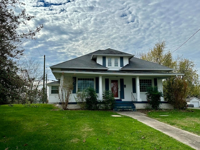 bungalow with a porch and a front yard