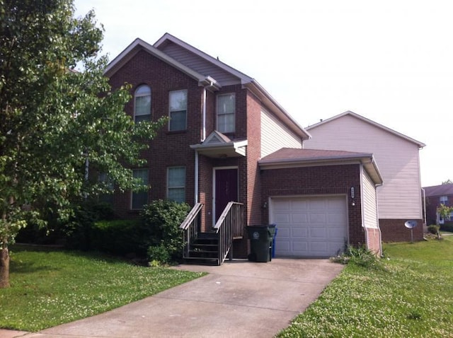 view of front of home featuring a garage and a front lawn