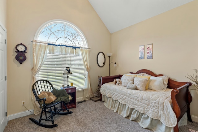 bedroom with light carpet and high vaulted ceiling