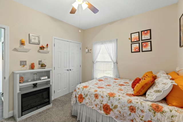 bedroom featuring carpet floors, a closet, and ceiling fan