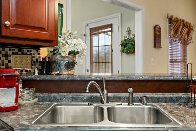 kitchen with decorative backsplash and sink