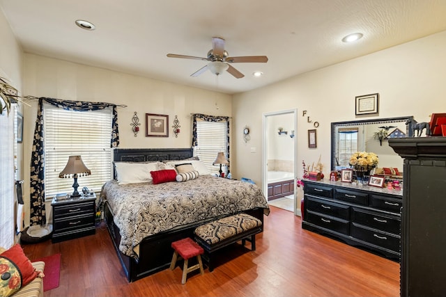 bedroom featuring multiple windows, ceiling fan, and dark wood-type flooring