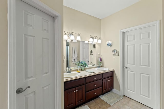 bathroom with tile patterned flooring and vanity