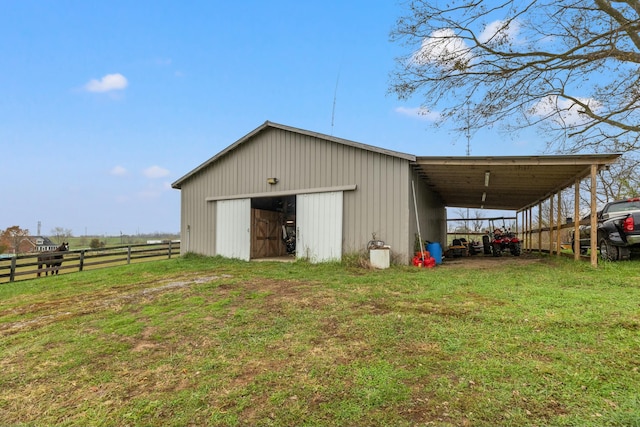 view of outbuilding featuring a yard