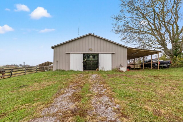 view of outbuilding with a lawn