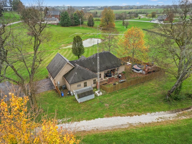 birds eye view of property with a rural view