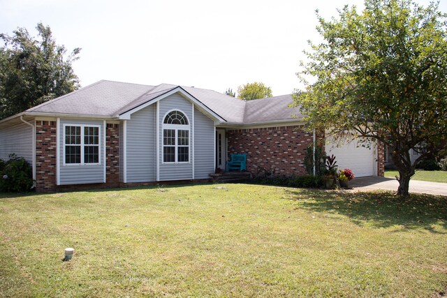 single story home featuring a garage and a front yard