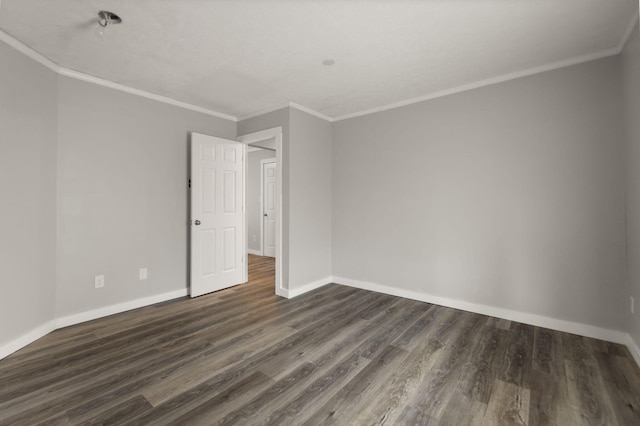 empty room with crown molding and dark wood-type flooring