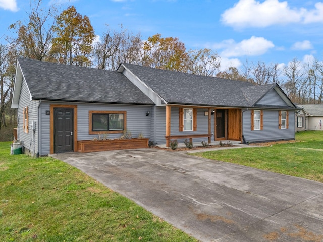 ranch-style home with covered porch and a front lawn