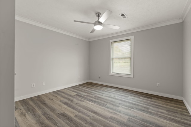 empty room with hardwood / wood-style flooring, ceiling fan, ornamental molding, and a textured ceiling