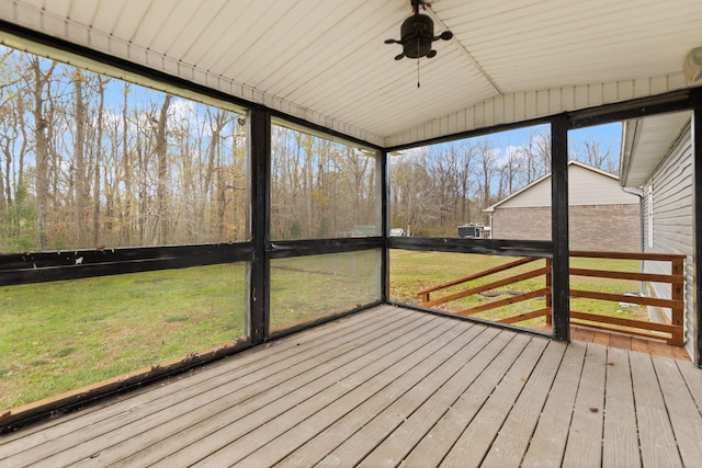 unfurnished sunroom featuring lofted ceiling