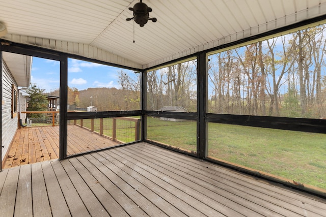 unfurnished sunroom featuring vaulted ceiling and ceiling fan