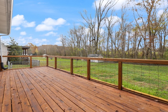 deck featuring a lawn