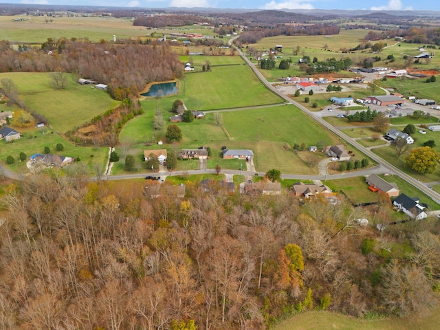 drone / aerial view featuring a rural view and a water view