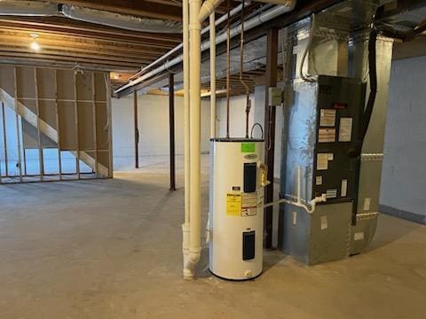 basement with heating unit and electric water heater