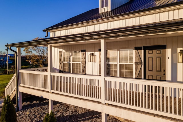 view of side of property featuring metal roof