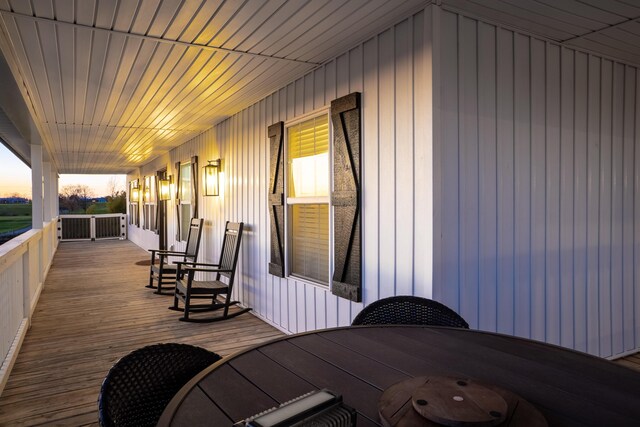 deck at dusk with a porch