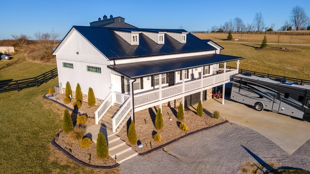 view of front of property featuring a garage and a balcony