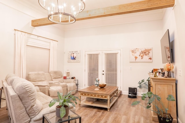living room with beam ceiling, baseboards, a chandelier, and wood finished floors
