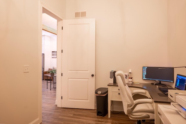office with visible vents and wood finished floors