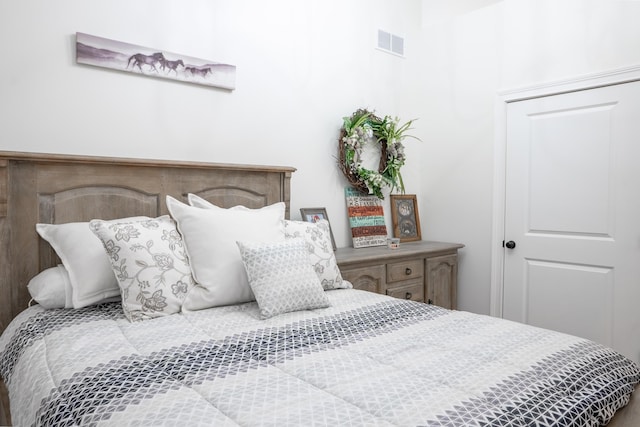 bedroom featuring visible vents