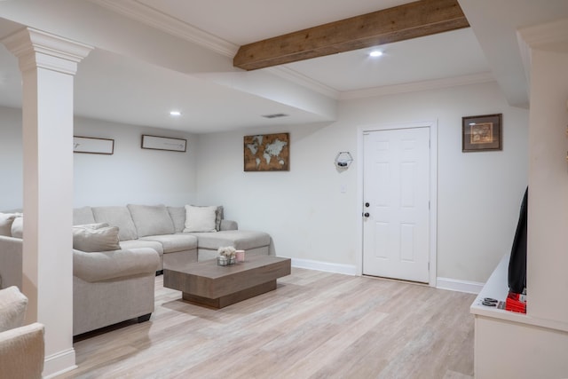 living area featuring light wood-style flooring, baseboards, beamed ceiling, and visible vents