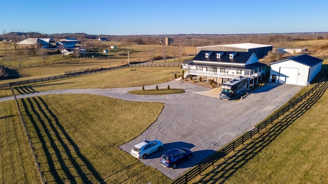 birds eye view of property featuring a rural view