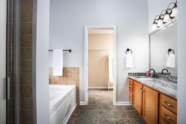 bathroom featuring a bathing tub and vanity