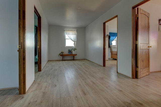 unfurnished room with light hardwood / wood-style flooring