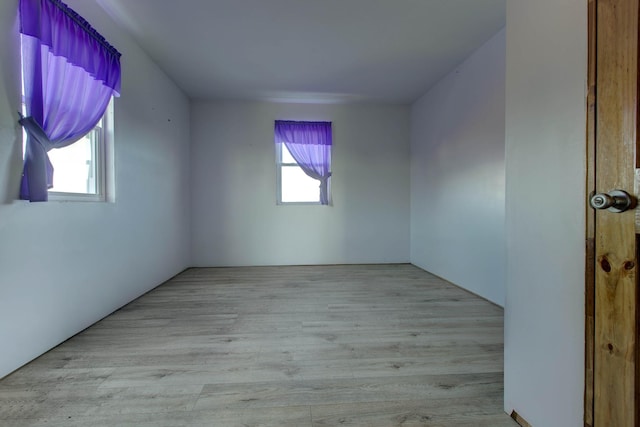 spare room with light hardwood / wood-style flooring