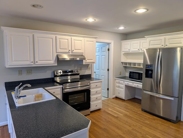 kitchen with white cabinetry, sink, appliances with stainless steel finishes, and light hardwood / wood-style flooring