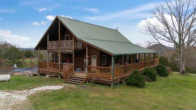 exterior space featuring a mountain view and a front yard