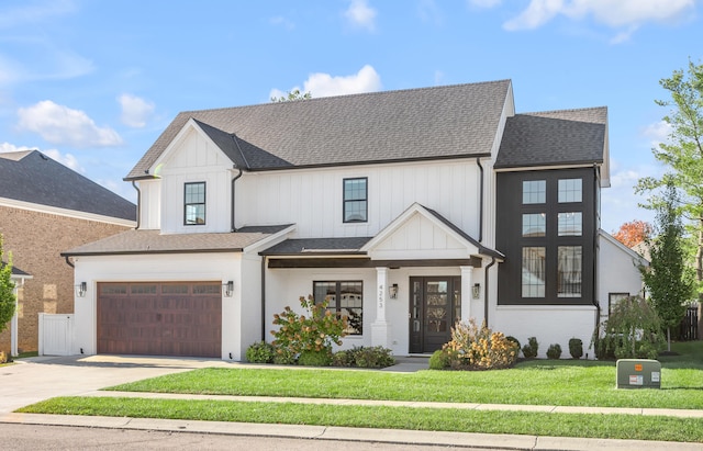 view of front facade with a front yard and a garage