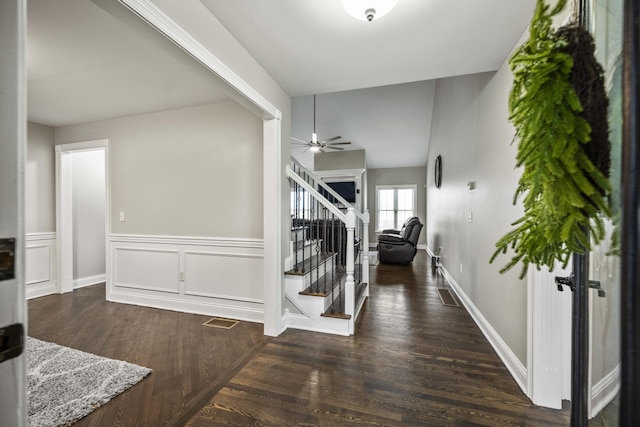 entrance foyer with dark wood-type flooring and ceiling fan