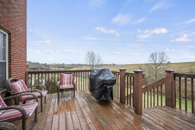 wooden deck featuring grilling area