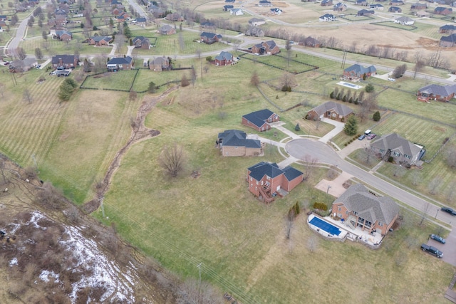 birds eye view of property with a rural view