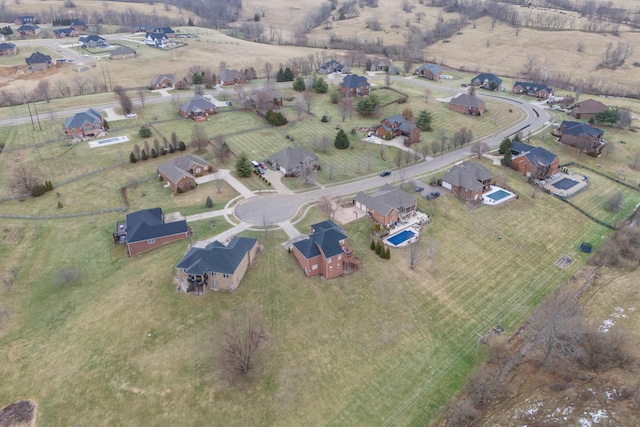 birds eye view of property with a rural view