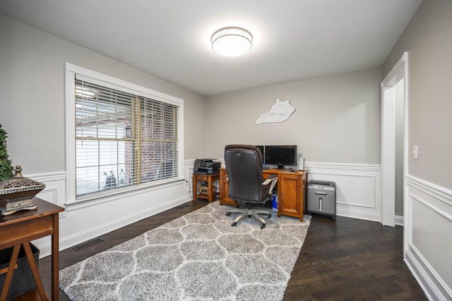 home office with dark wood-type flooring