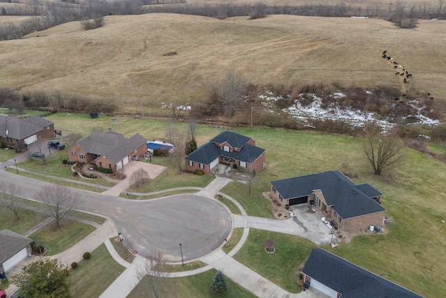 birds eye view of property with a rural view