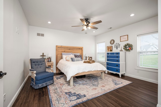 bedroom featuring dark hardwood / wood-style floors and ceiling fan