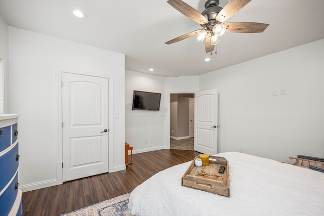 bedroom featuring ceiling fan and dark wood-type flooring