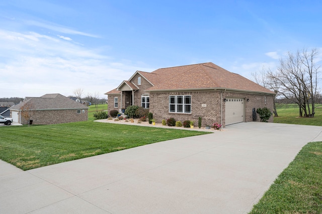 view of front of property with a front lawn and a garage