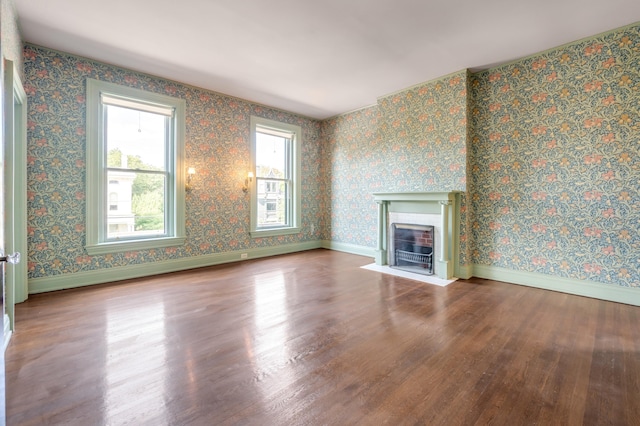 unfurnished living room featuring hardwood / wood-style floors