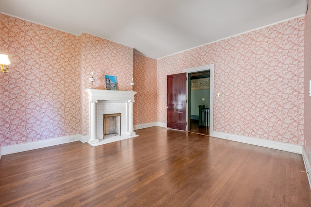 unfurnished living room featuring a fireplace and hardwood / wood-style flooring